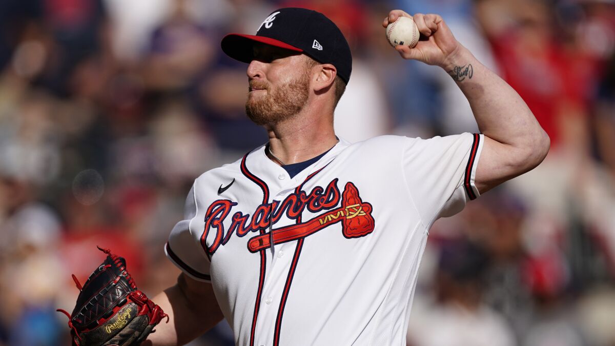 Braves closer Will Smith pitches against the Brewers in Game 3.