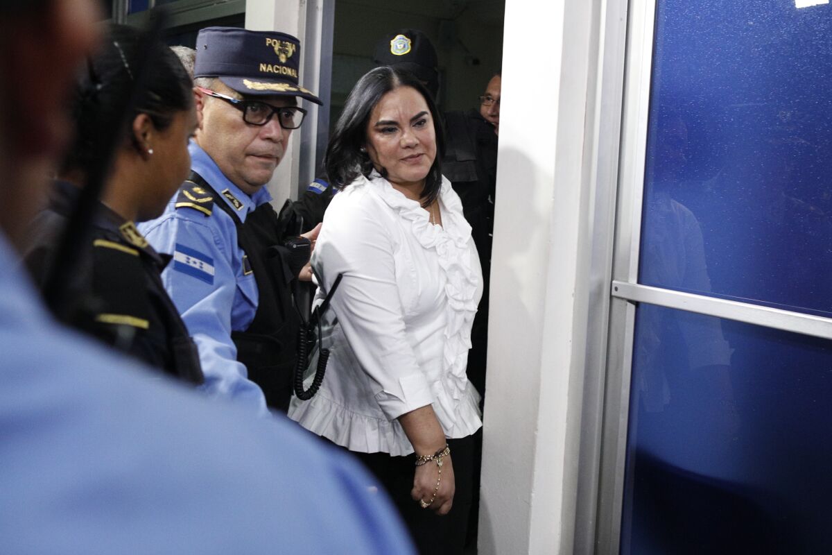 FILE - In this Aug. 20, 2019 file photo, former Honduran first lady Rosa Elena Bonilla de Lobo leaves court after her conviction on corruption charges in Tegucigalpa, Honduras. The Supreme Court of Justice of Honduras on Friday, March 13, 2020, annulled the corruption trial in which Bonilla de Lobo was convicted of fraud and sentenced to serve 58 years. (AP Photo/Elmer Martinez, File)