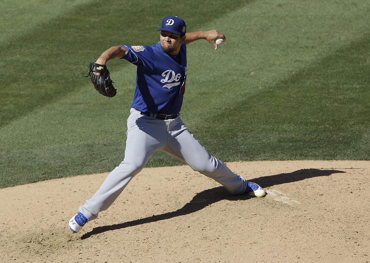Dodgers relief pitcher Luis Avilan (43) throws against the Arizona Diamondbacks during a spring training game in Scottsdale, Ariz. on March 18.