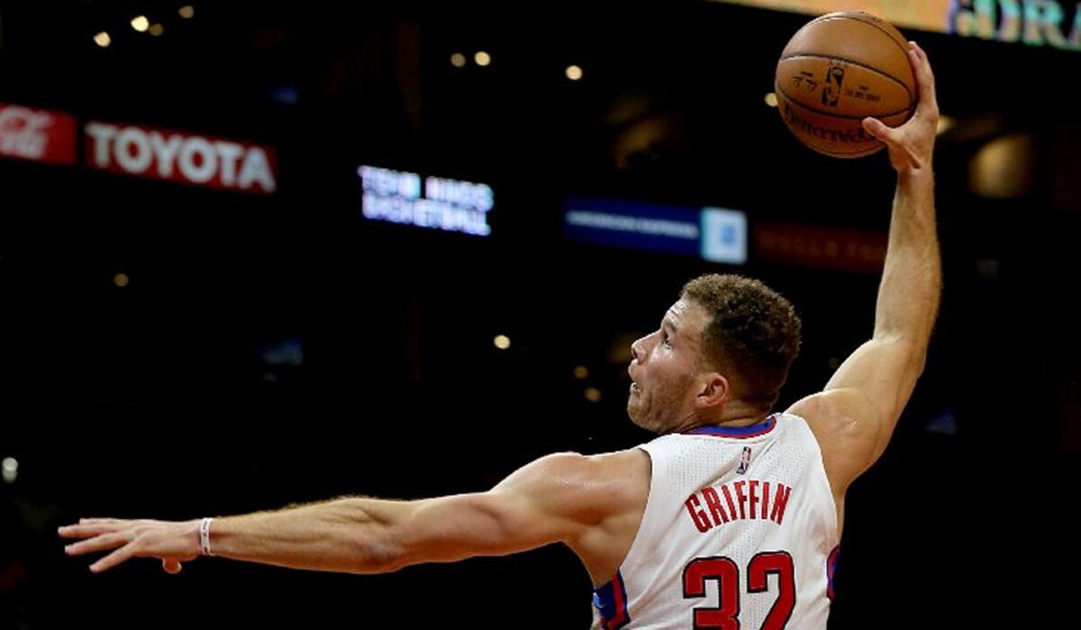Clippers power forward Blake Griffin throws down a dunk over Milwaukee Bucks forward Giannis Antetokounmpo during a game on Dec. 16.