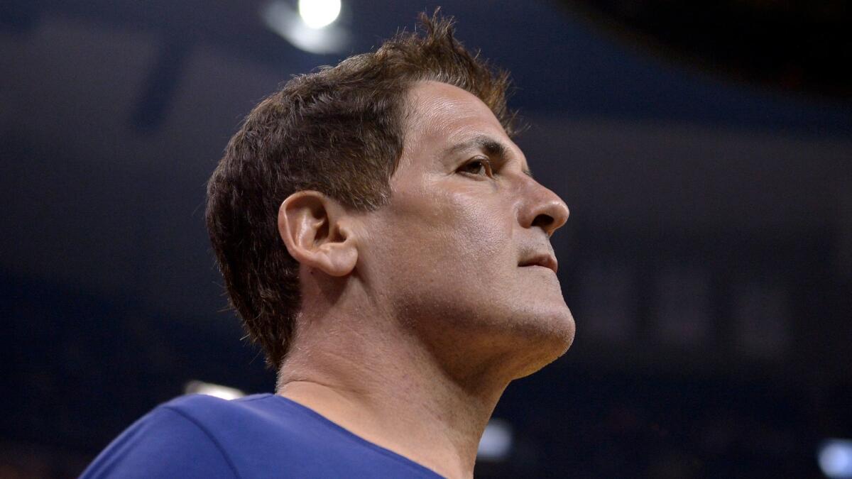 Dallas Mavericks owner Mark Cuban walks off the court after the first half of a game against Memphis on April 12.