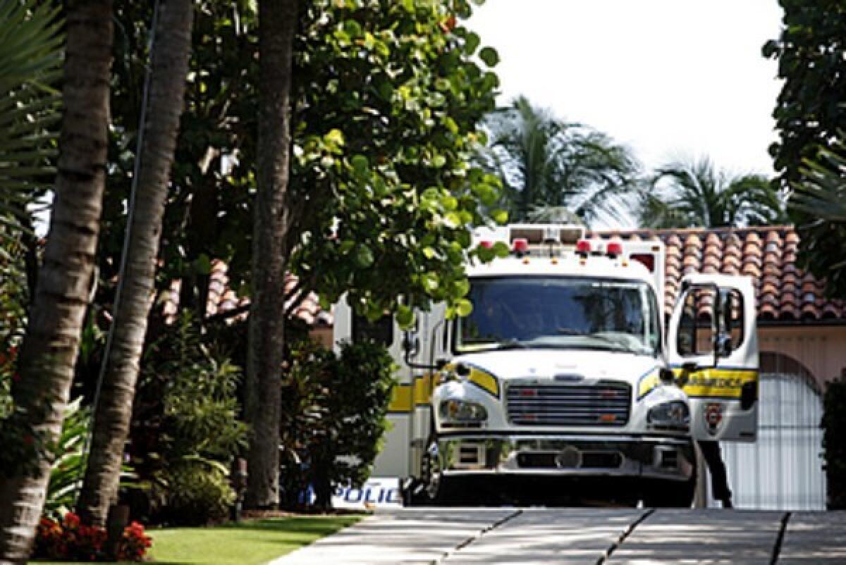 An emergency vehicle is parked at the mansion of Jeffry Picower. Investors had accused him of being the biggest beneficiary of Bernard Madoff's schemes