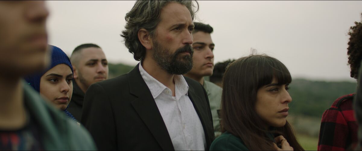Alex Bakri and Juna Suleiman in the movie "Let It Be Morning."