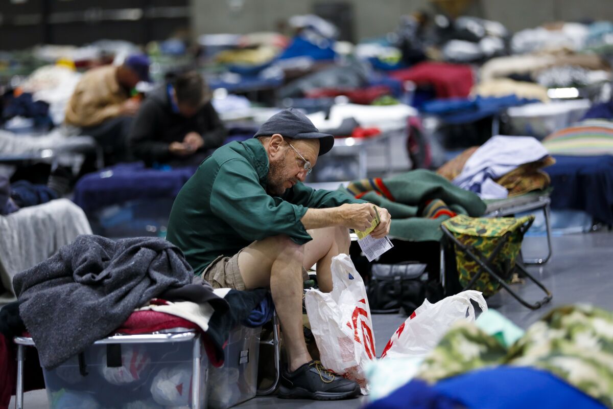 Tom Shelley is among the 829 homeless men and women that have been sheltered in the temporary shelter set up at the San Diego Convention Center.