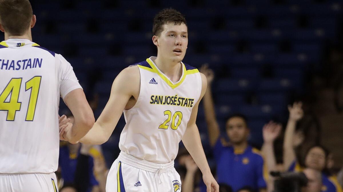 San Jose State guard Noah Baumann celebrates with teammate Ashtin Chastain after making a three-pointer against New Mexico on Feb. 26.