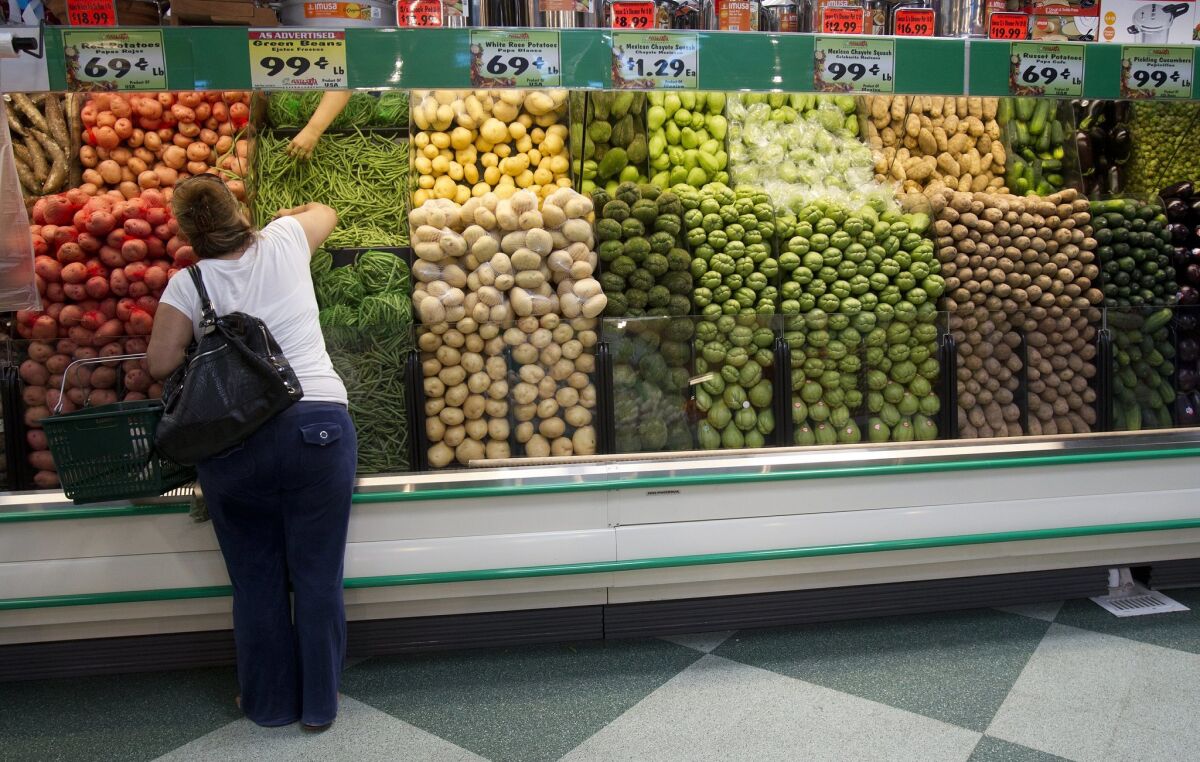 A customer shops for produce at a Vallarta Supermarket in National City. 