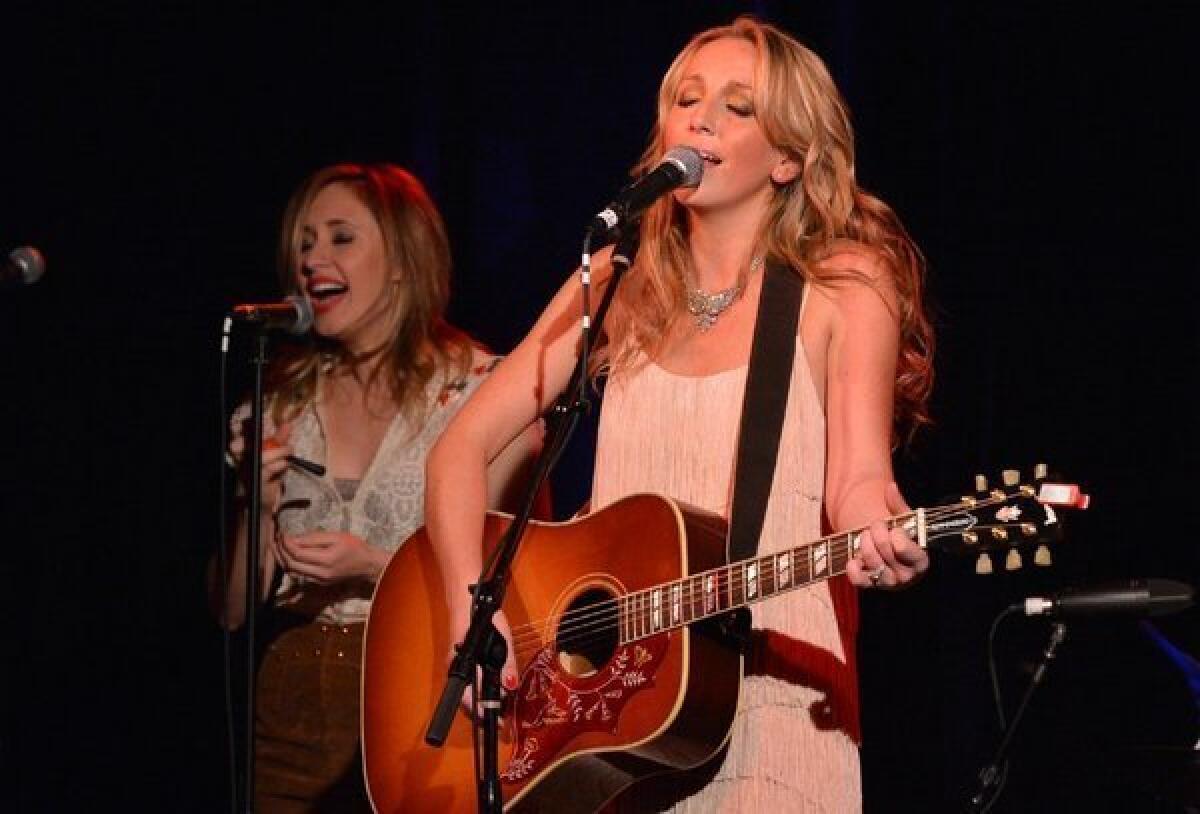 Ashley Monroe, right, with singer/songwriter Jessi Alexander during the Nashville release party for "Like a Rose" earlier this month.