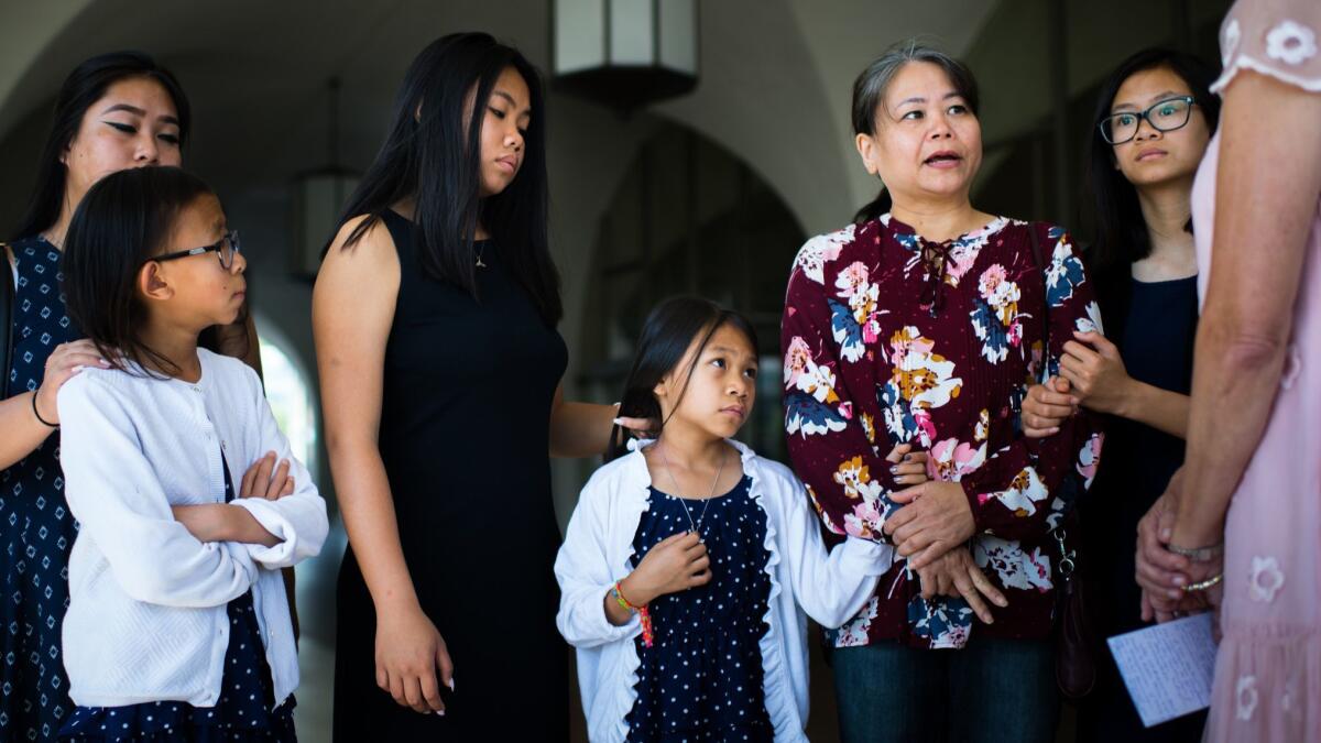 The family of Michael Phuong Minh Nguyen appears with Rep. Mimi Walters at a news conference Thursday. Nguyen, a U.S. citizen from Orange, has been detained by the Vietnamese government for nearly four weeks.