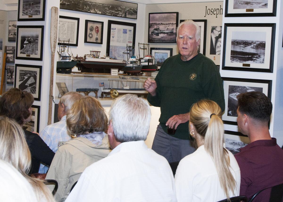 Doug Devine, Marine veteran, speaks at a community open house at Balboa Island Museum.