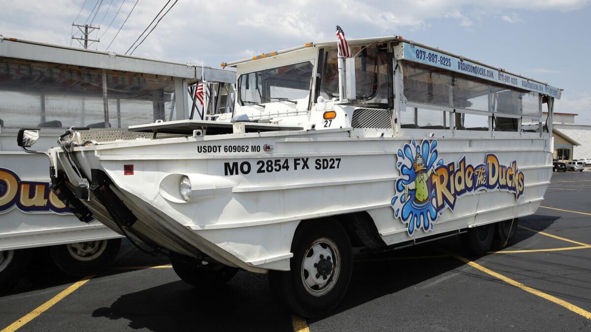 A duck boat in the parking lot of Ride the Ducks, an amphibious tour operator in Branson, Mo.