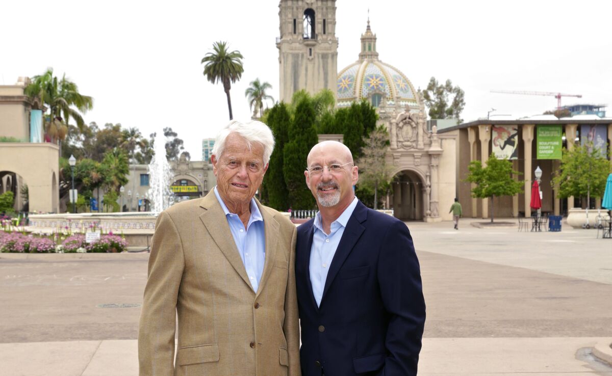 Malin Burnham, left, and Tad Parzen in Balboa Park, one of many target projects for Burnham Center for Community Advancement.