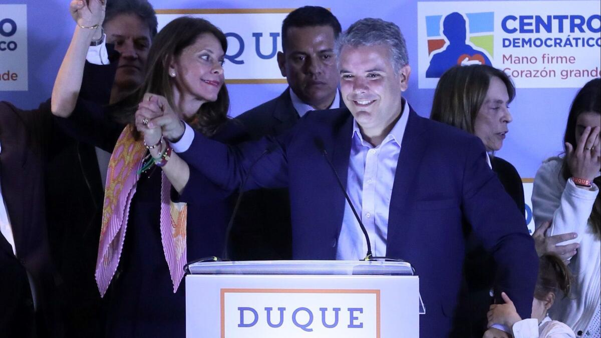 Ivan Duque greets supporters in Bogota, Colombia. Duque was declared winner in a primary election and is the presidential candidate for the right. Voters confirmed Marta Lucia Ramirez as his vice presidential running mate.