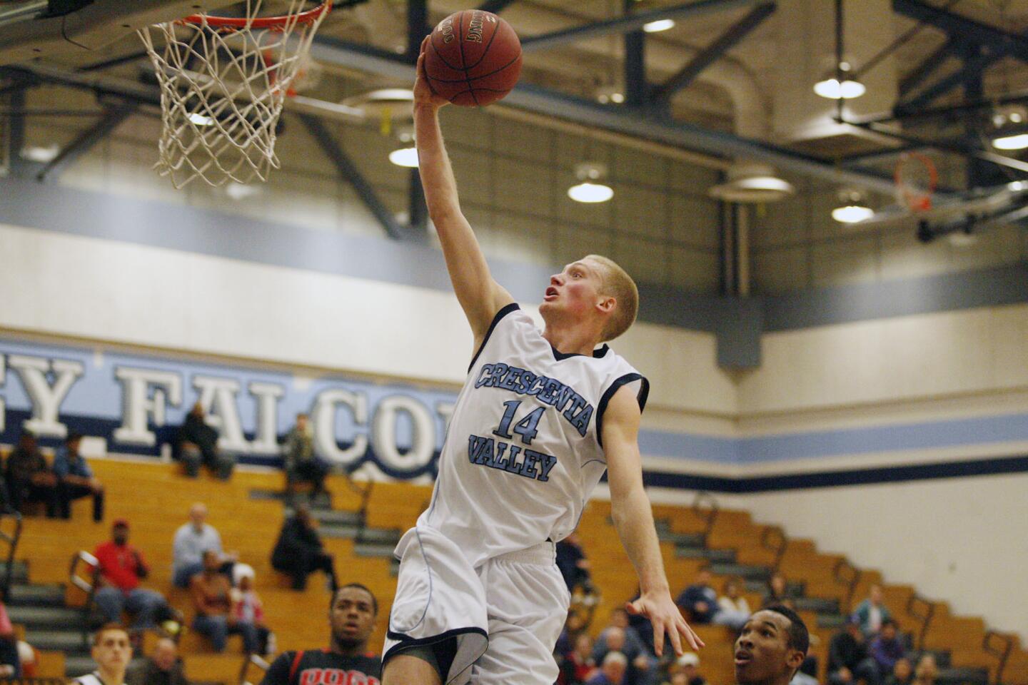 CV's Cole Currie goes for a layup and makes it during a game against Pasadena at Crescenta Valley High School on Wednesday, January 16, 2013.