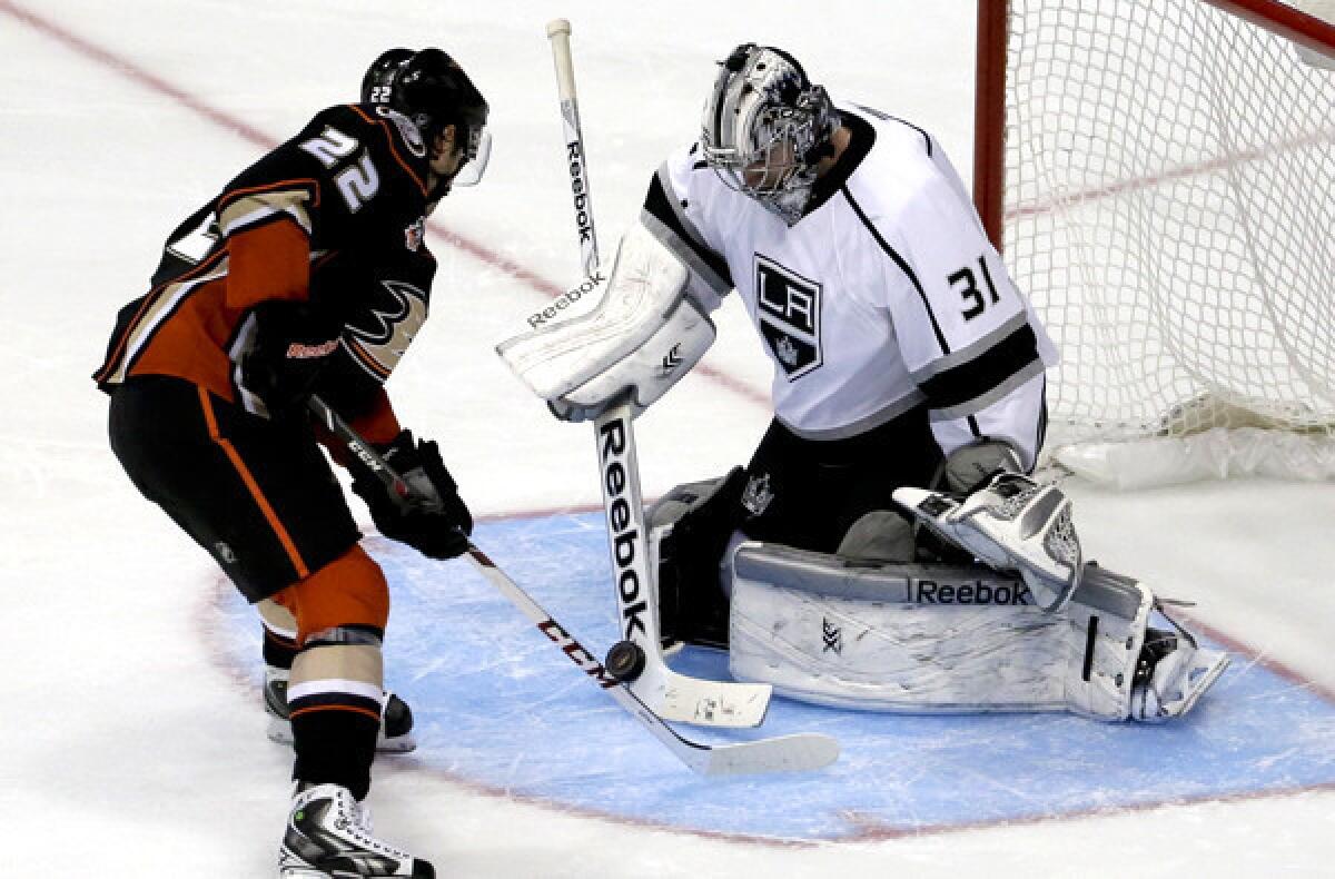 Kings goalie Martin Jones (31) stops a shot by Ducks center Mathieu Perreault to clinch a shootout victory over the Ducks on Tuesday night.