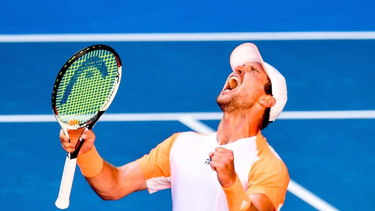 Mischa Zverev of Germany reacts en route to victory over Andy Murray of Britain at the Australian Open.