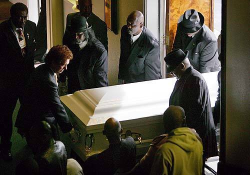 Pallbearers carry the body of Stanley "Tookie" Williams to his memorial service in Los Angeles, Calif. Williams, the convicted murderer and writer, was executed last week despite a campaign to save his life.