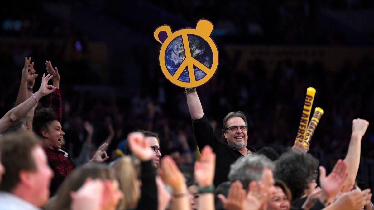 Fans cheer for Lakers forward Metta World Peace after he sank a 3-pointer during the second half against the New Orleans Pelicans on Tuesday.