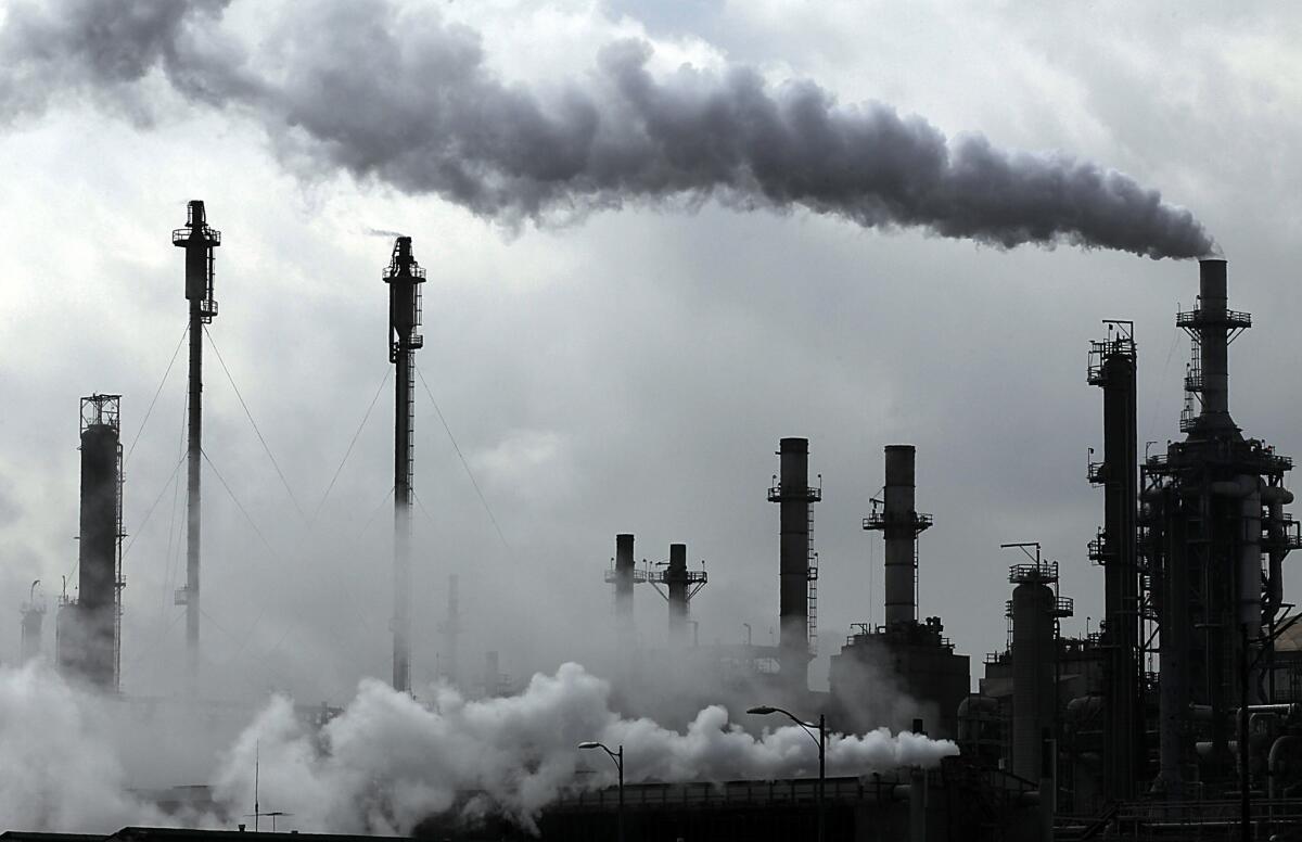 A refinery pumps out emissions in the process of producing gasoline.