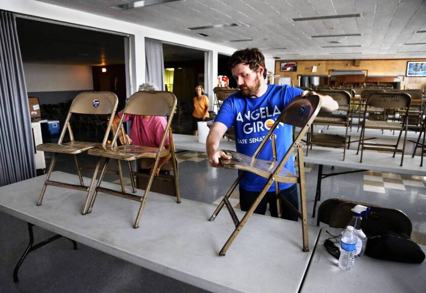 Volunteers clean up a union hall in Pueblo, Colo., that was used in state Sen. Angela Giron’s unsuccessful anti-recall campaign. The National Rifle Assn. bankrolled the recall effort after she voted for gun control measures.