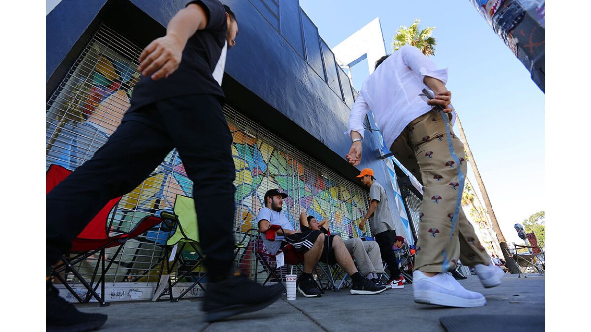 Streetwear hipsters hang outside Supreme on Fairfax.