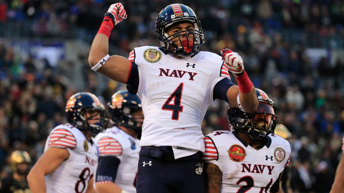 Navy wide receiver Jamir Tillman celebrates after catching a touchdown pass against Army on Saturday.