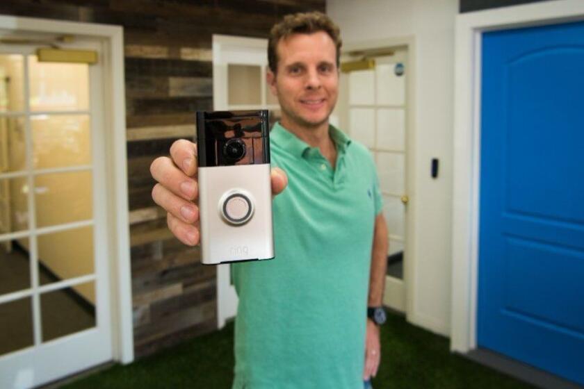 SANTA MONICA, CA - APRIL 24, 2017: Ring founder and chief executive Jamie Siminoff holds a Ring Video Doorbell in the lobby of Ring's Santa Monica office. (Michael Owen Baker / For The Times)