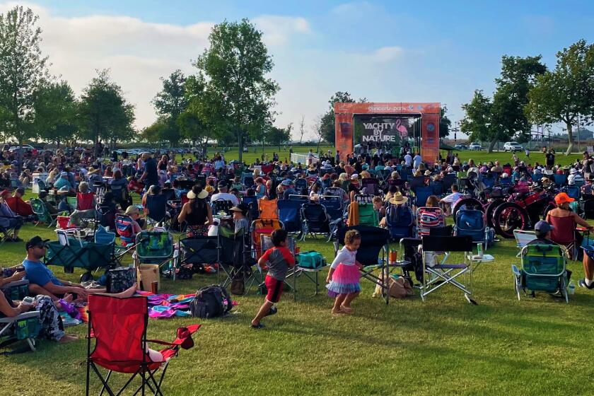 Locals at Costa Mesa's Fairview Park Tuesday enjoy a performance from Yachty By Nature during Concerts in the Park.
