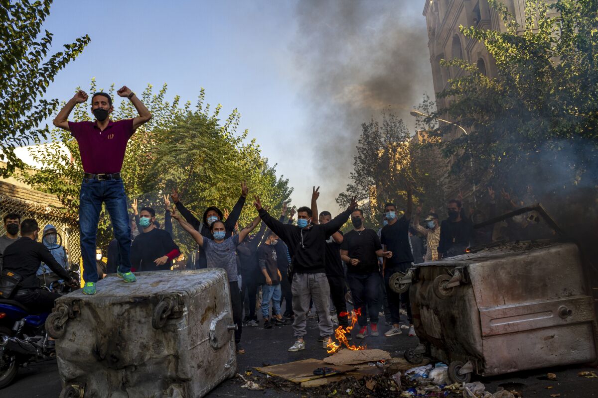 2022 fifa world cup Iranians protest in Tehran over the death of 22-year-old Mahsa Amini, who died in police custody in September.
