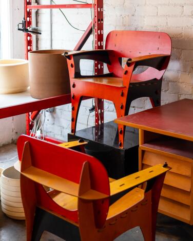 A pair of David Kawecki Puzzle Chairs stands on display at the Motley Design Warehouse.