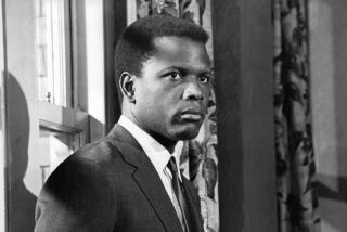 Sidney Poitier standing near door in a scene from the film 'To Sir, With Love'