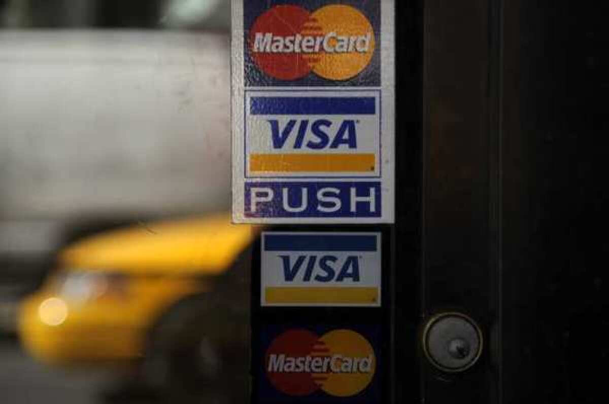 The Visa and MasterCard logos. Law enforcement officials are investigating what appears to be a massive theft of U.S. consumers' credit card data, MasterCard and Visa confirmed Friday.