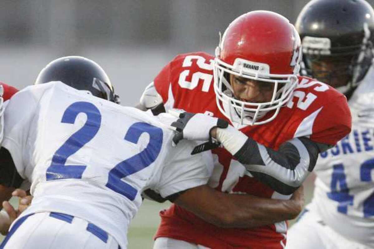 ARCHIVE PHOTO: Burroughs' running back Israel Montes runs up the middle against North Hollywood.
