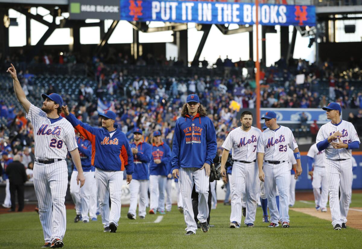 "Put it in the books" reads the message overhead as the New York Mets salute fans after their season finale.