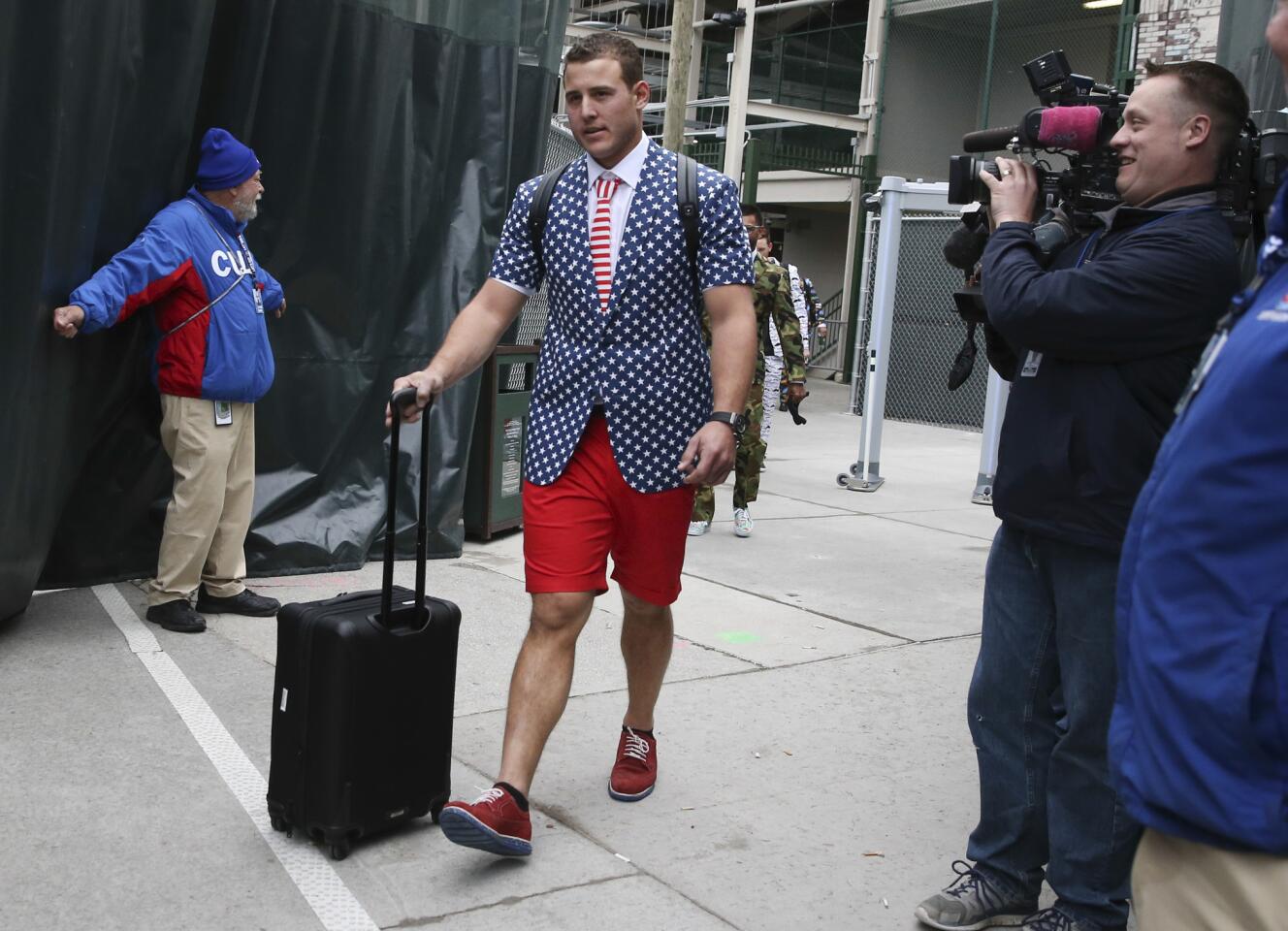 Anthony Rizzo heads for the bus in his zany suit.
