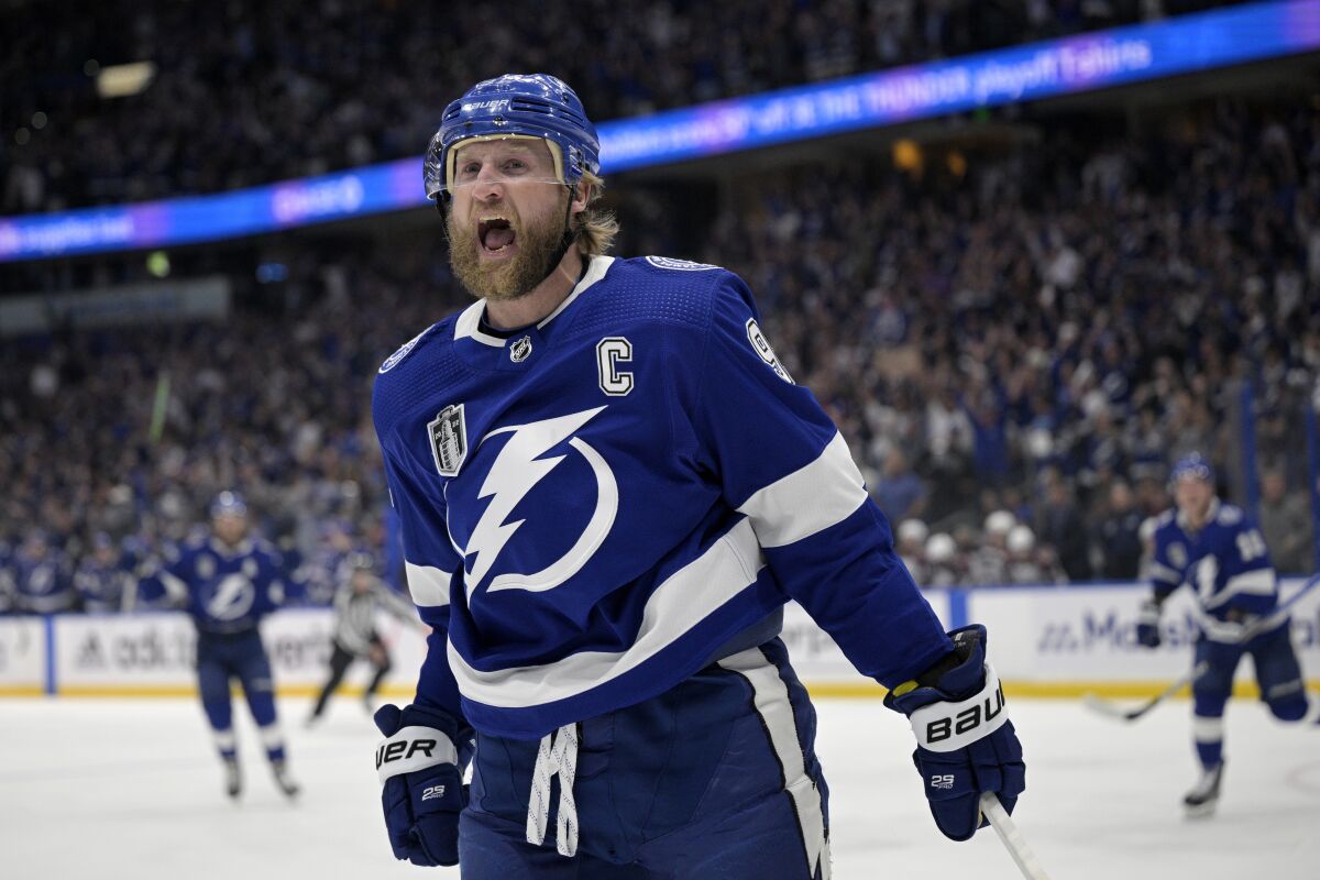 FILE - Tampa Bay Lightning center Steven Stamkos reacts after his goal during the first period of Game 6 of the NHL hockey Stanley Cup Finals against the Colorado Avalanche on Sunday, June 26, 2022, in Tampa, Fla. Three months after falling short in a bid to become the first club in 40 years to win three straight Stanley Cup titles, the Lightning entered training eager to begin the quest to reclaim the crown they relinquished to the Colorado Avalanche last season. (AP Photo/Phelan Ebenhack, File)