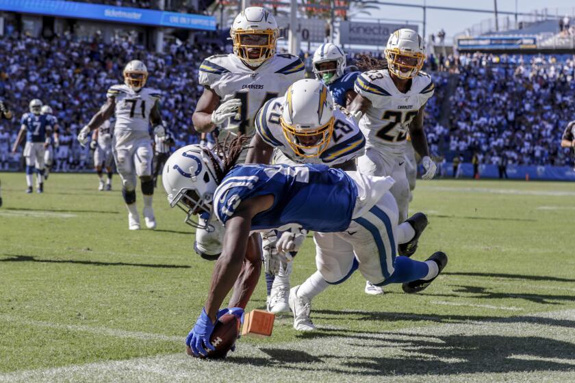 CARSON, CA, SUNDAY, SEPTEMBER 8, 2019 - Colts receiver TY Hilton dives for a touchdown past Chargers defenders late in the fourth quarter at Dignity Health Sports Park. (Robert Gauthier/Los Angeles Times)