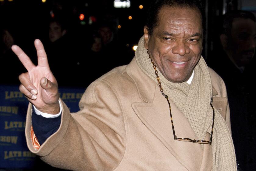 FILE - In this Dec. 21, 2009, file photo, John Witherspoon leaves a taping of "The Late Show with David Letterman" in New York. Actor-comedian Witherspoon, who memorably played Ice Cube’s father in the “Friday” films, has died at age 77. Witherspoon’s manager Alex Goodman confirmed late Tuesday, Oct. 29, 2019, that Witherspoon died in Los Angeles. (AP Photo/Charles Sykes, File)