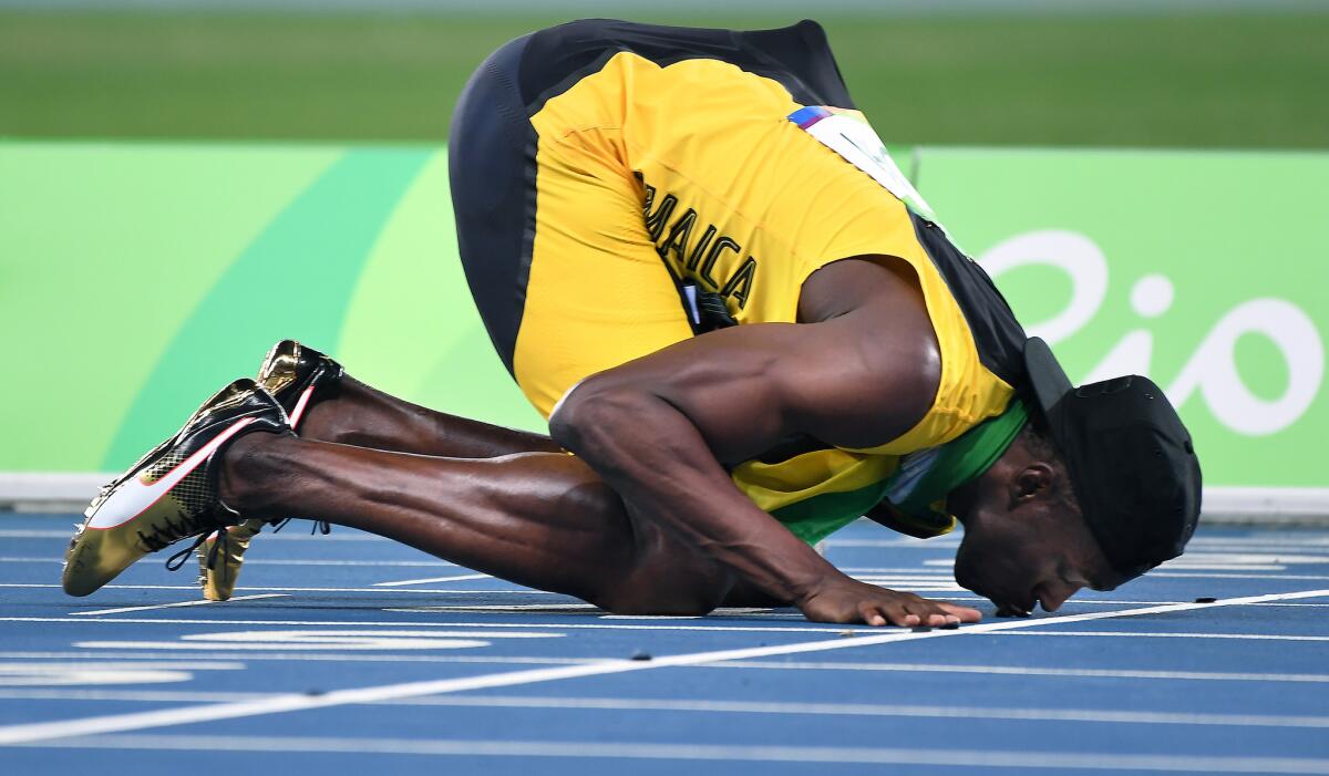 Usain Bolt kisses the track one last time after winning gold in the 400-meter relay at the Rio Olympics.