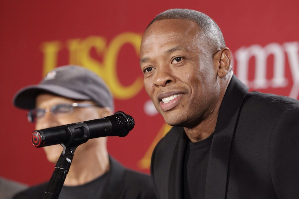 Jimmy Iovine, the co-founder of Interscope Records, left, stands with partner hip-hop mogul Dr. Dre, as they announce a $70 million dollar donation to create the new "Jimmy Iovine and Andre Young Academy for Arts and Technology and Business Innovation" at the University of Southern California during a news conference at in Santa Monica.