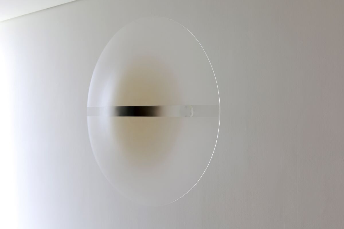 Robert Irwin's 1969 "Untitled" is an acrylic disk mounted on the wall.