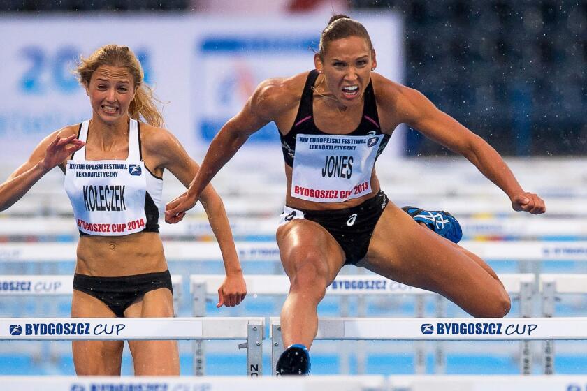 Lolo Jones, right, wins the women's 100-meter hurdles race at the European Athletic Festival Bydgoszcz Cup in Bydgoszcz, Poland, on June 2.