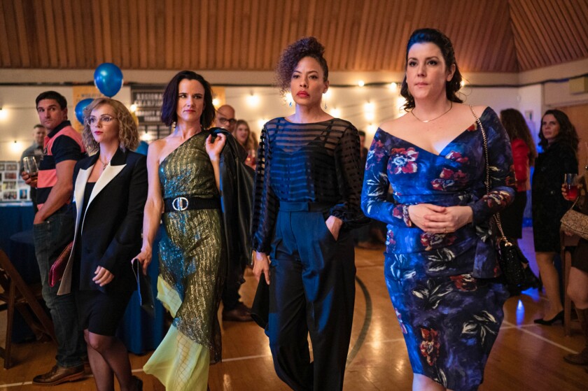 Four women arrive at their 25th high-school reunion.