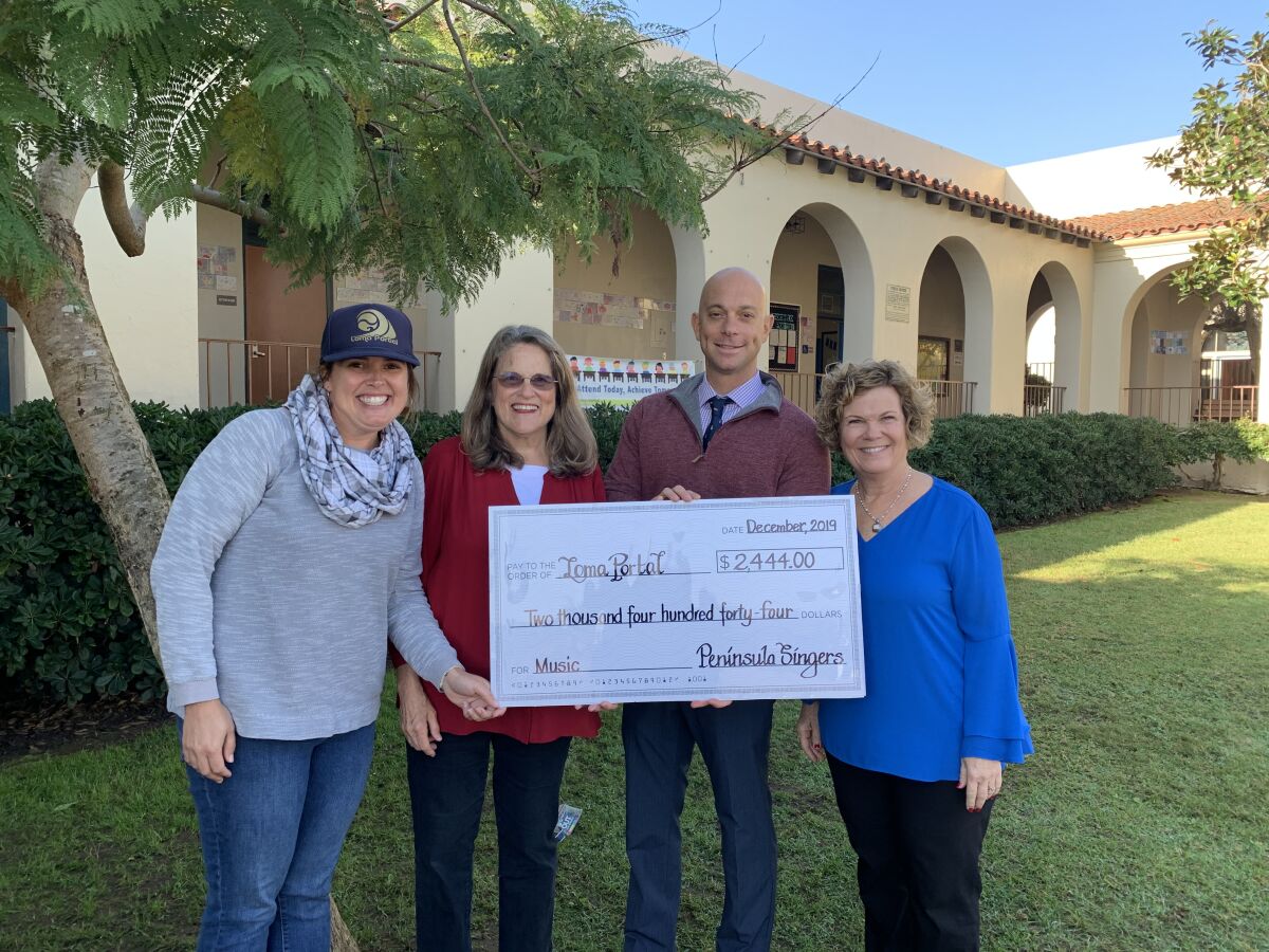 Peninsula Singers present a check to Loma Portal’s Foundation president Valerie Lawson, Principal Mark Morici and music teacher Candy Szalay.