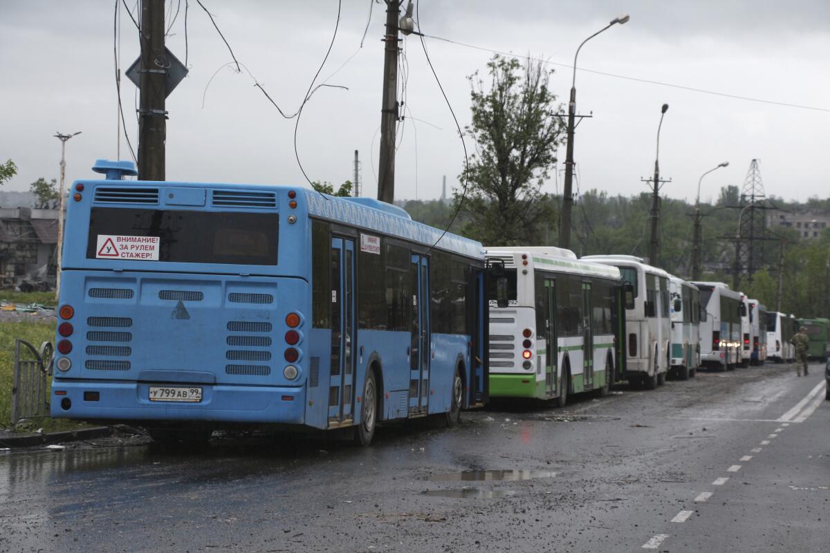 Buses lined up to transport surrendered Ukrainian servicemen