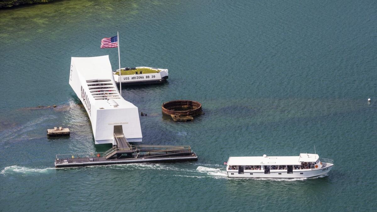 The dock of the USS Arizona Memorial, seen in this file photo, was struck by a Navy ship on Wednesday, forcing the closure of the popular Pearl Harbor tourist attraction.
