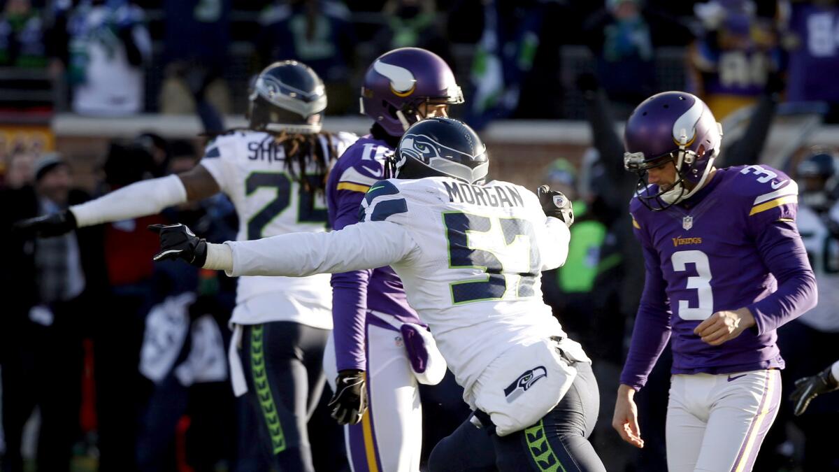 Seahawks players celebrate after Vikings kicker Blair Walsh (3) missed a 27-yard field-goal attempt with 22 seconds left in the game Sunday.