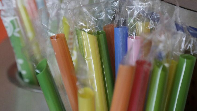 Plastic straws sit at the ready at a cafe in San Francisco. The state is considering barring dine-in restaurants from providing plastic straws unless they are requested by patrons.