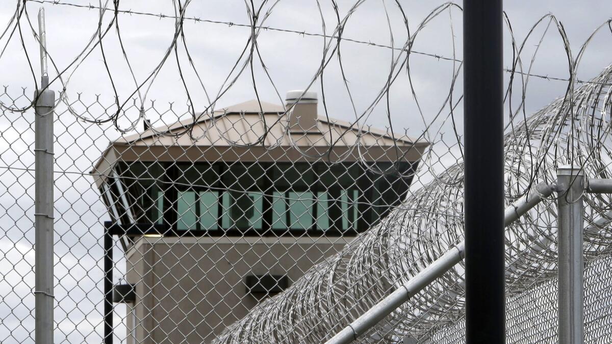 A guard tower overlooks the fence surrounding the California Correctional Health Care Facility in Stockton.