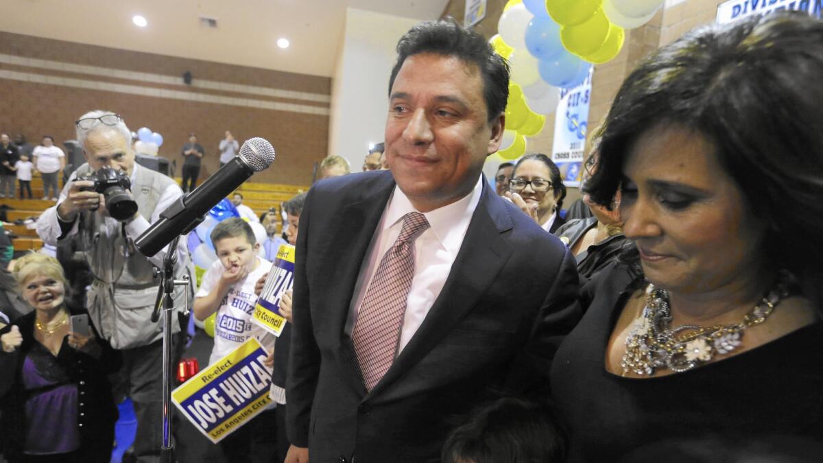 Councilman Jose Huizar acknowledges the help he received from his wife, Richelle, on election night at his headquarters at Salesian High School.