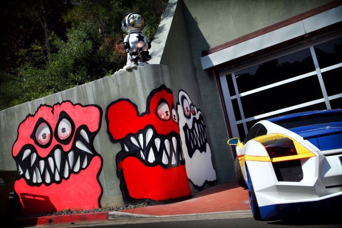 Neigbors are angry at entertainer Chris Brown's street art painted outside his Hollywood Hills home.